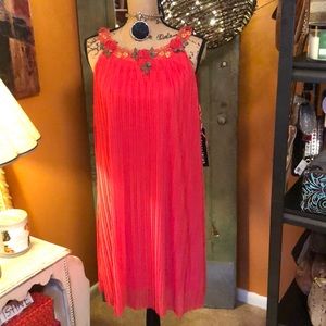 Coral dress with flowery neckline